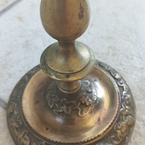 Metal candlestick used, gold color with brass finish
