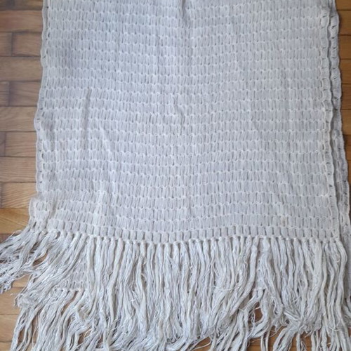 Knitted white scarf used with slight yellowing