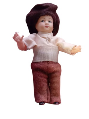 Celluloid doll used with brown hat and pants, about 10 cm