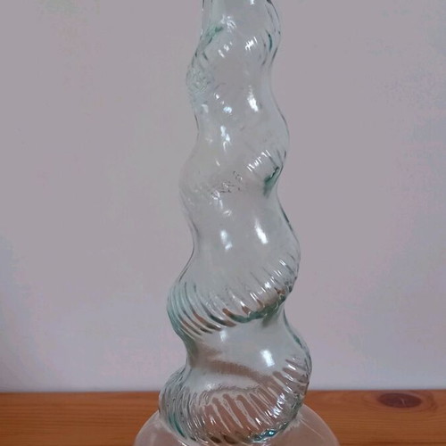 Collectible vintage glass bottle with twisted design like new