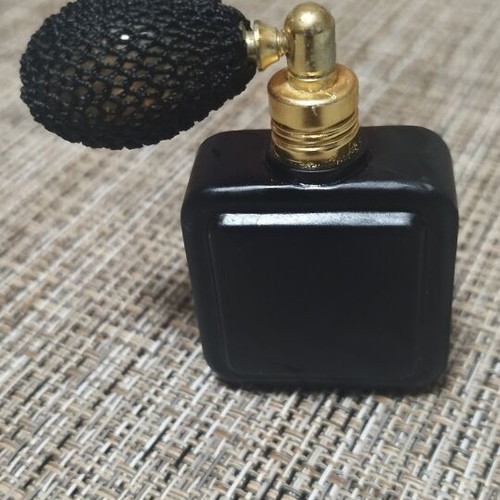 Vintage perfume bottle empty, like new, black with gold details