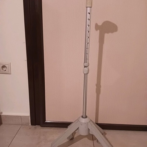 Walking cane with four-legged base used