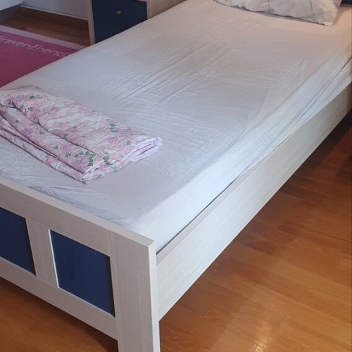 Blue bedroom set with desk, bookshelves and bed
