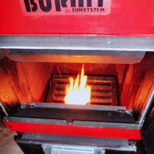 Pellet and wood boiler used with silo