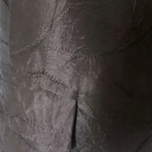 Black jacket used with shiny fabric