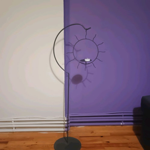Handmade floor candlestick with hanging sun, like new, 1m height