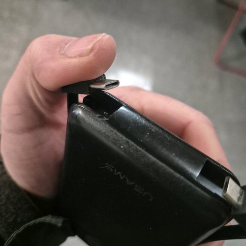 USAMS Power Bank 10,000mAh used with digital display and built-in cables