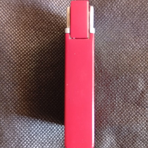 Prince lighter red metal promotional like new