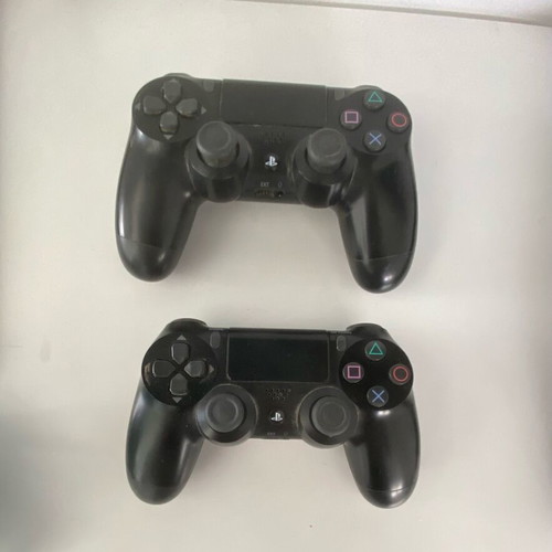 PlayStation 4 Slim 500GB used with 2 controllers and 4 games