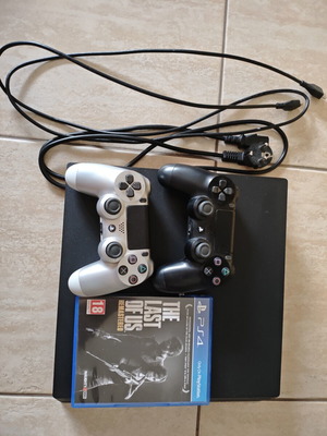 PlayStation 4 Pro 1TB used with 2 Dualshock controllers and The Last of Us Remastered