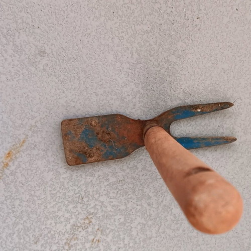 Garden hoe used with wooden handle and double head