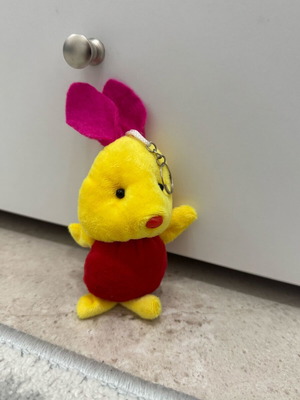 Keychain doll like new, pink and yellow