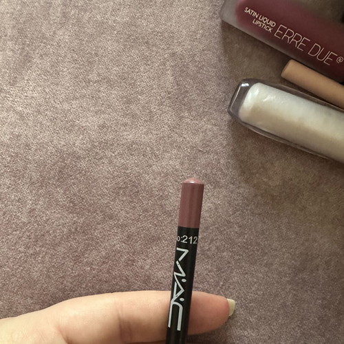 Wet and Wild eyeshadow palette and assorted lip products