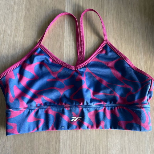Reebok women's sports bra M used, blue and pink