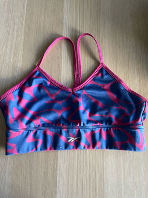 Reebok women's sports bra M used, blue and pink