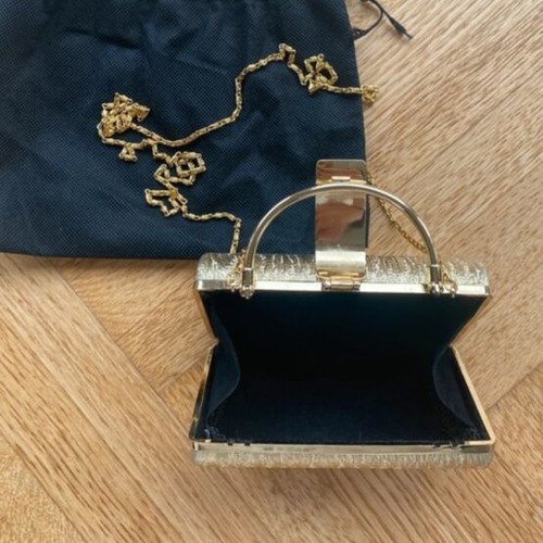 Gold clutch bag with chain strap