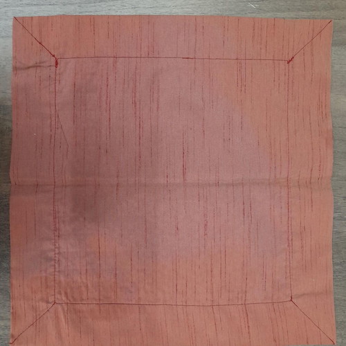 Napkin new with circle pattern in burgundy and gold