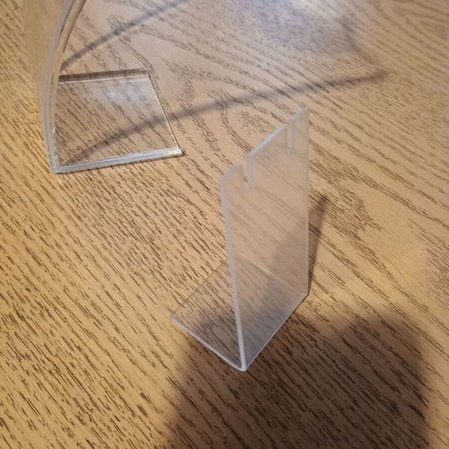 Jewelry stands used, one large transparent and one small matte