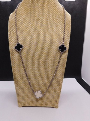 Silver Triple Clover necklace like new with 3 black and white clovers