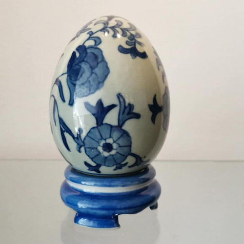 Porcelain egg used with blue designs and stand