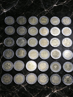 2 euro coins used, lot of 36 with album