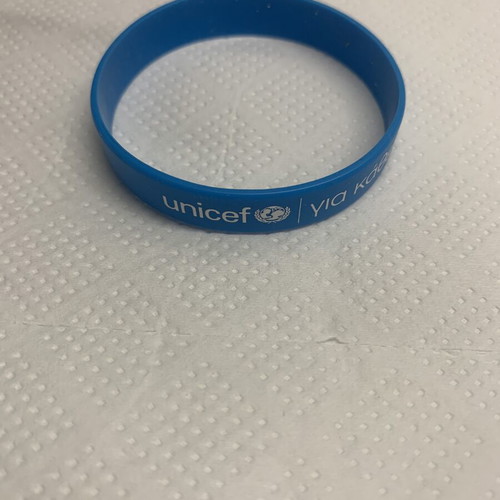 Unicef bracelet new, blue rubber with message
