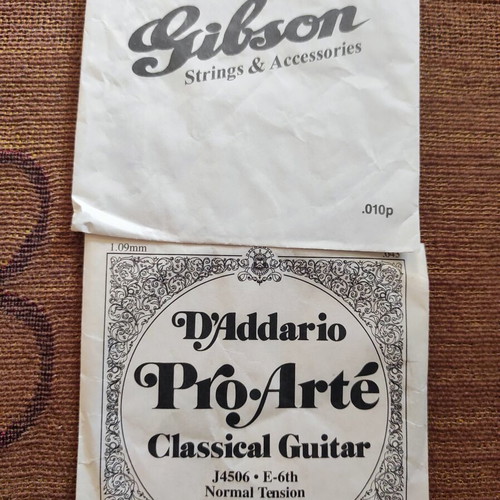 Guitar string set like new, 4 electric and 2 classical
