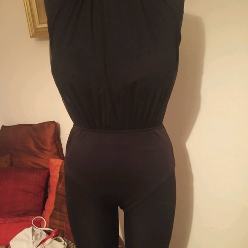 Black one-piece swimsuit with tulle used, size small