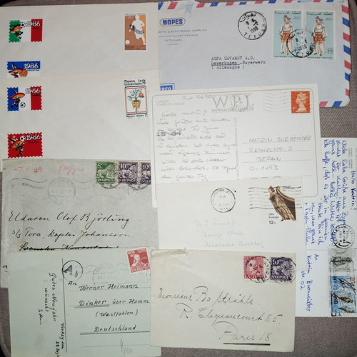 Collection of envelopes and stamps from around the world, new