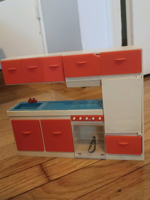 Vintage toy kitchen used for small dolls with broken door