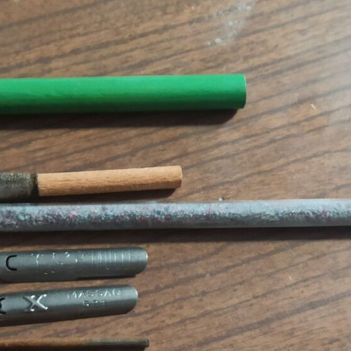 Wooden stationery box with used pencils and ink cartridges set