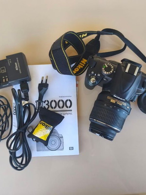 Nikon D3000 camera with AF-S 18-55mm f/3.5-5.6 lens and bag
