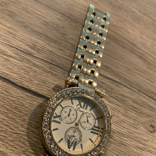 Golden wristwatch, women's