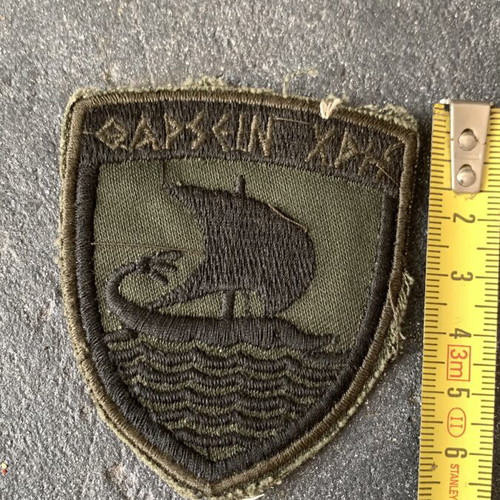 Military insignia used, as shown