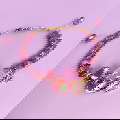 Minnie βραχιόλι λιλά/ροζ/χρυσό like new με ματάκι και ροζ πέτρα