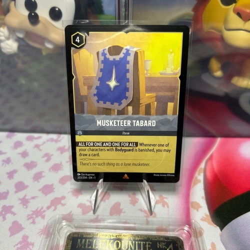 Disney Lorcana TCG card Musketeer Tabard σε άριστη κατάσταση