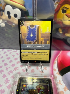 Disney Lorcana TCG card Musketeer Tabard σε άριστη κατάσταση