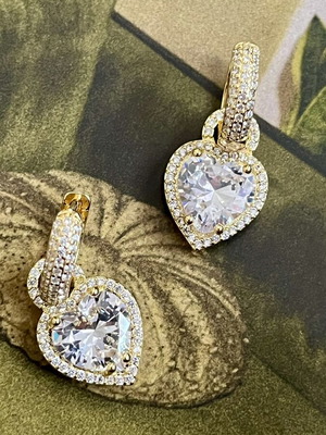 Gold-tone earrings with heart-shaped transparent stone and zircon details