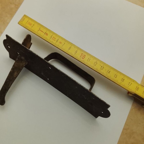Traditional door handle-latch used