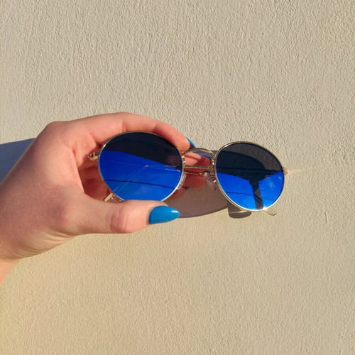 Sunglasses with blue mirror lenses and gold frame