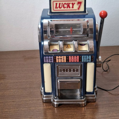 Marksman Las Vegas Lucky 7 AM/FM radio used, one armed bandit slot machine