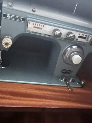 Mercedes sewing machine used with wooden cabinet
