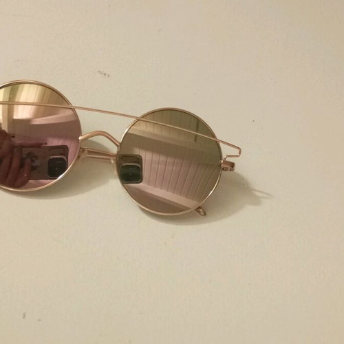 Sunglasses like new with rose gold frame and color-changing lenses