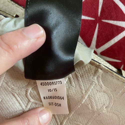 Calvin Klein crossbody bag used, beige with embossed logo