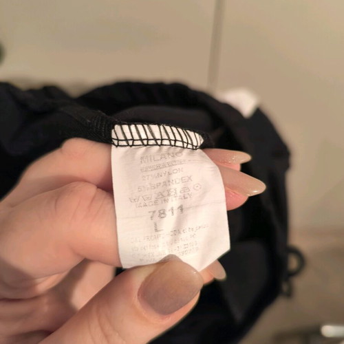 sweatpants with a white stripe on the side and an elastic waistband