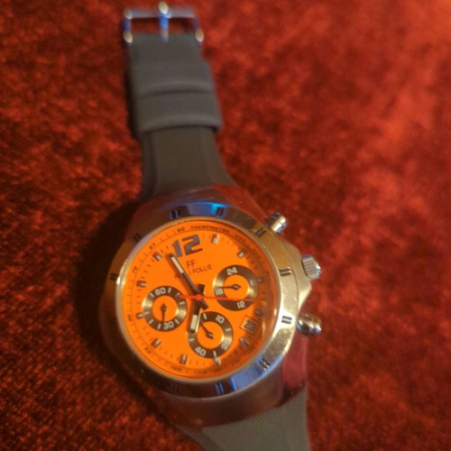Folli Follie watch used with chronographs and orange dial