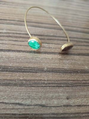 Metal bracelet with two stones like new, gold and green