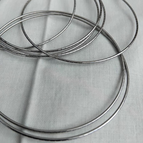 Bracelet of 7 Days with 7 braided rings silver color like new