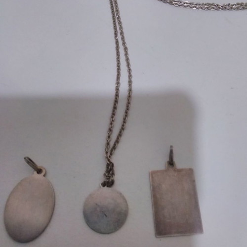 Silver pendant necklace used with zodiac and catholic figures