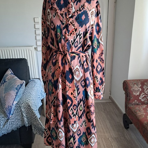 Pom dress used with geometric pattern in pink, blue and green